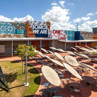 Mural of mixed native american and mexican tile patterns at an LA high school created by Add Fuel