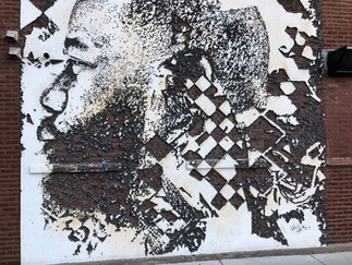 etched portrait of Joe Freshgoods on a wall in Chicago. Created by Vhils
