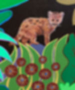 close up on a little cub with colorful flowers and bushes all around