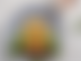 Owl made of a waffle, egg, sausage, and vegetables