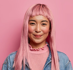 good-looking-happy-girl-with-long-rosy-hair-expresses-positive-attitude-wears-long-sleeved