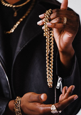 Image-by-Dusan-Jovic-via-Unsplash-african-american-model-with-a-gold-chain-in-his-hands.jp