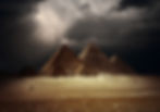 Great pyramids in Giza valley with dark clouds on the background_edited.jpg