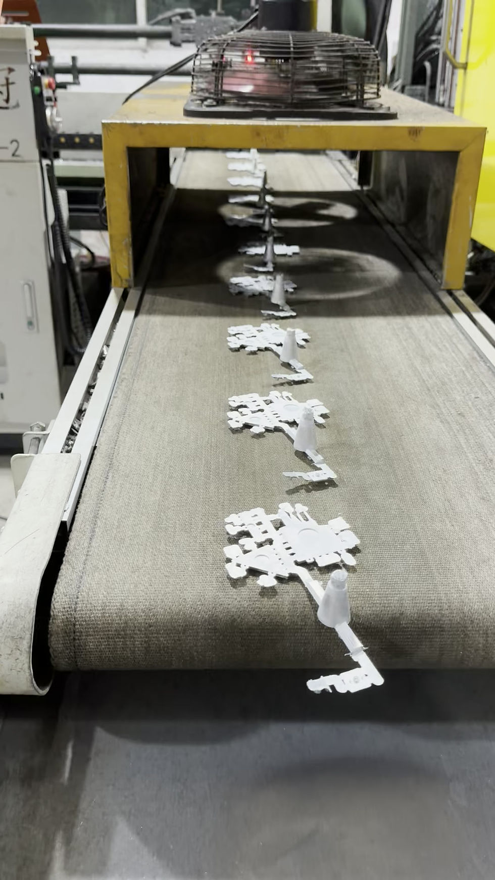 The die-casting machines at the factory are currently producing products.