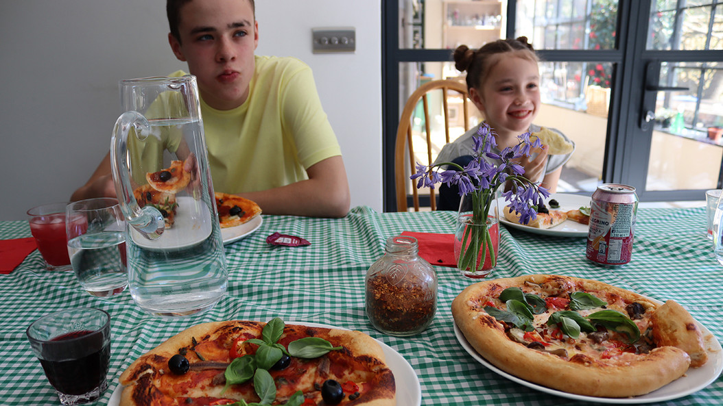 Freshly made pizza being loved by Fabio & Casia