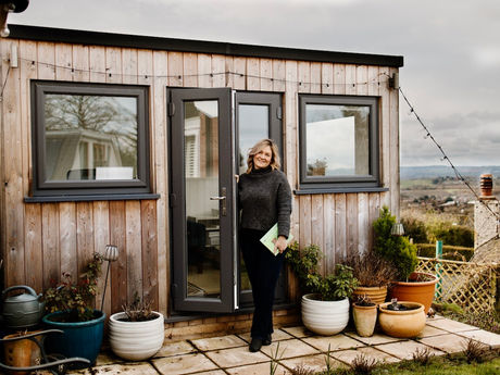 Woman standing outside of her office