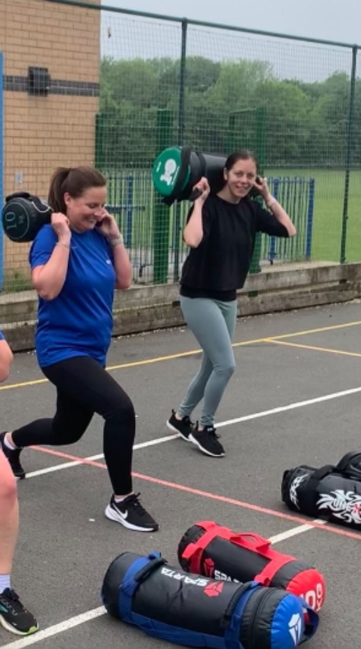 Sam smiling while working on her strength
