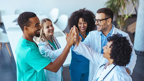 Healthcare professionals united in a celebratory gesture, showcasing collaboration, teamwo
