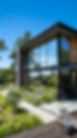 freepik__a-sleek-modern-house-with-large-windows-covered-in__84076.png