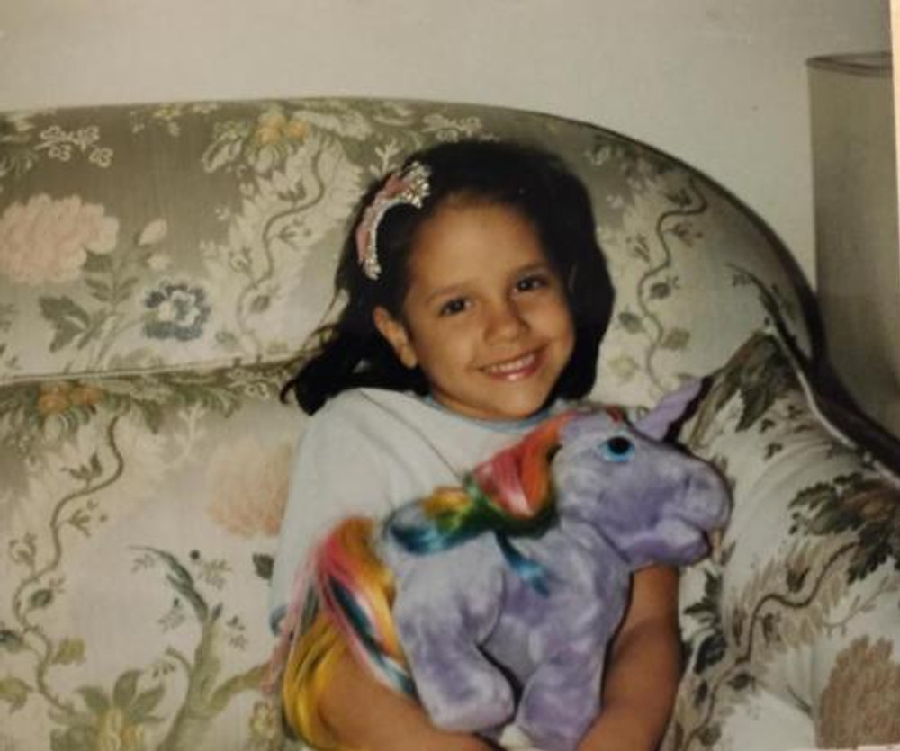 Little me, with one of my favorite toys. It’s a horse, of course!