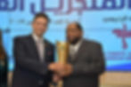 Mr. Towfik (right) receiving The United African and Arabs Achievement Award in 2019.
