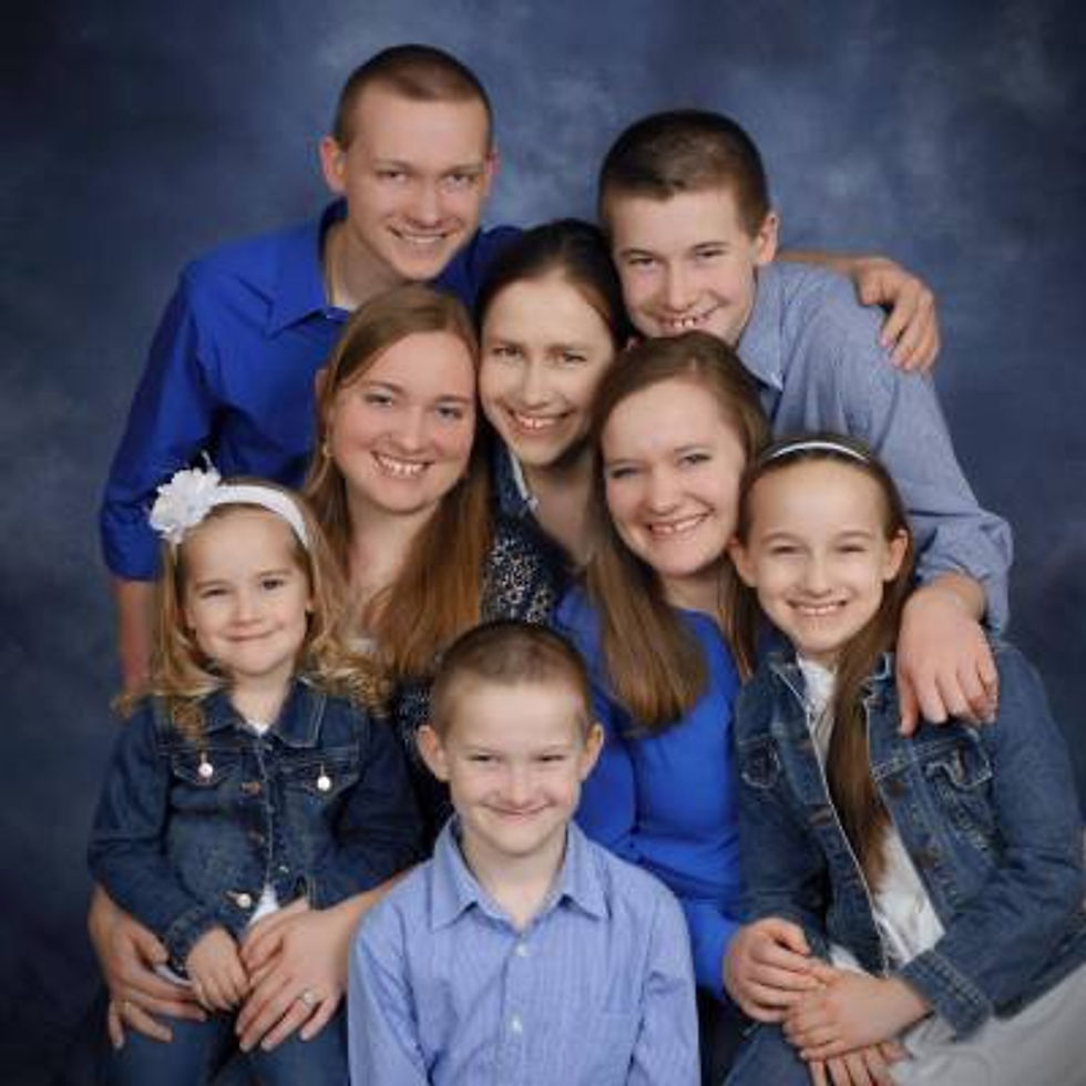 My siblings and me (I’m on the left with my little sister on my lap).