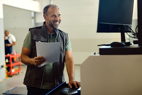 happy-mid-adult-pos-technician-working-computer-auto-repair-shop.jpg