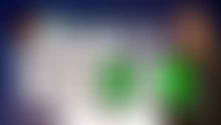 Member standing in front a rocket