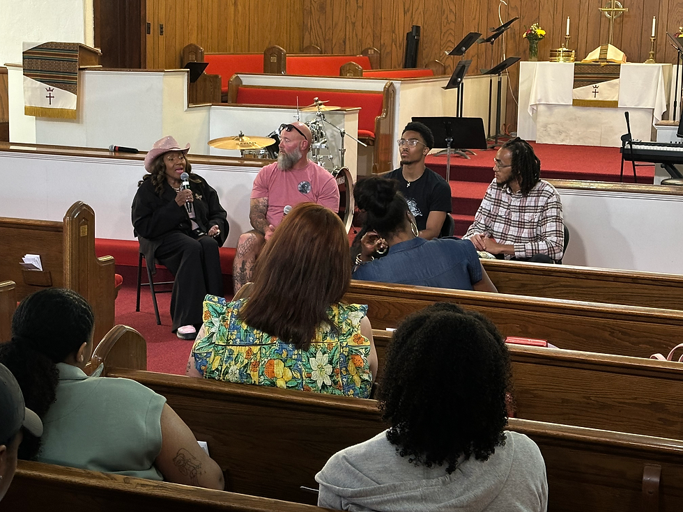 Event attendees and panelists tune in closely to Ms. Alice Westery as she speaks on the unhoused youth of Birmingham.