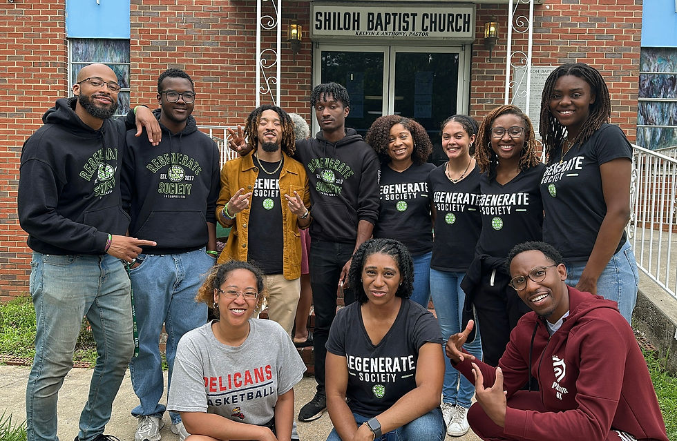 The Regenerate Society, Inc. team celebrates the first ever market sell-out with head pastor of Shiloh Baptist Church Norwood, Kelvin J. Anthony (bottom far right)