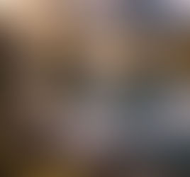 Still mountain lake reflecting snow-capped peaks and small tree-covered islets under soft morning sunlight, symbolizing divine watchfulness.