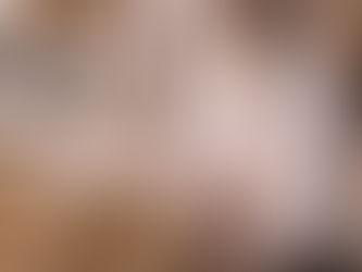 Alt text: An elderly Sikh man dressed in white sits cross-legged in silent contemplation beside the Guru Granth Sahib, which rests open on a richly embroidered cloth. His hands are gently folded in his lap, eyes closed in devotion. A chaur sahib lies across the scripture, with prayer beads and a small bowl placed nearby, while marble arches frame the scene and the Golden Temple and sacred pool appear softly in the background under warm daylight.