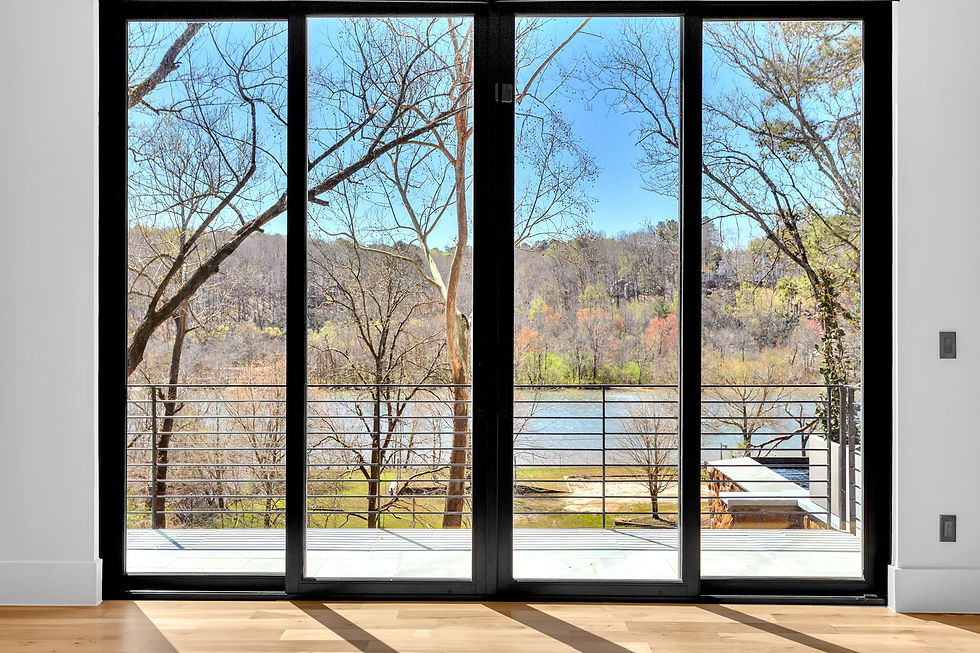 Modern glass doors by a high end custom home builder.