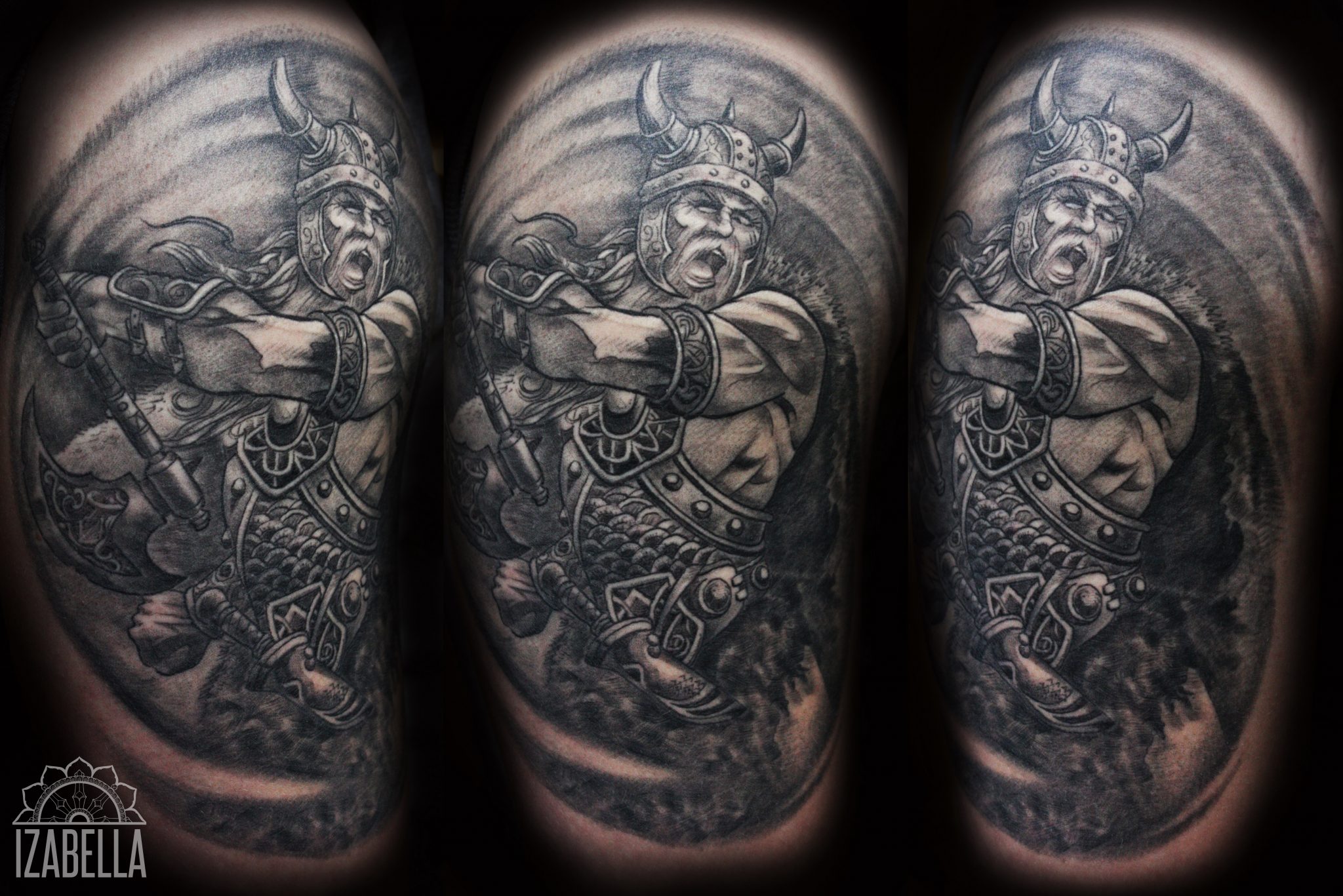 A detailed black and grey tattoo depicting a fierce warrior with long hair and a horned helmet, wielding an axe. The warrior is dressed in ornate armor, featuring intricate details like scales and decorative elements. The background showcases dynamic swirls, enhancing the sense of motion and intensity in the design.