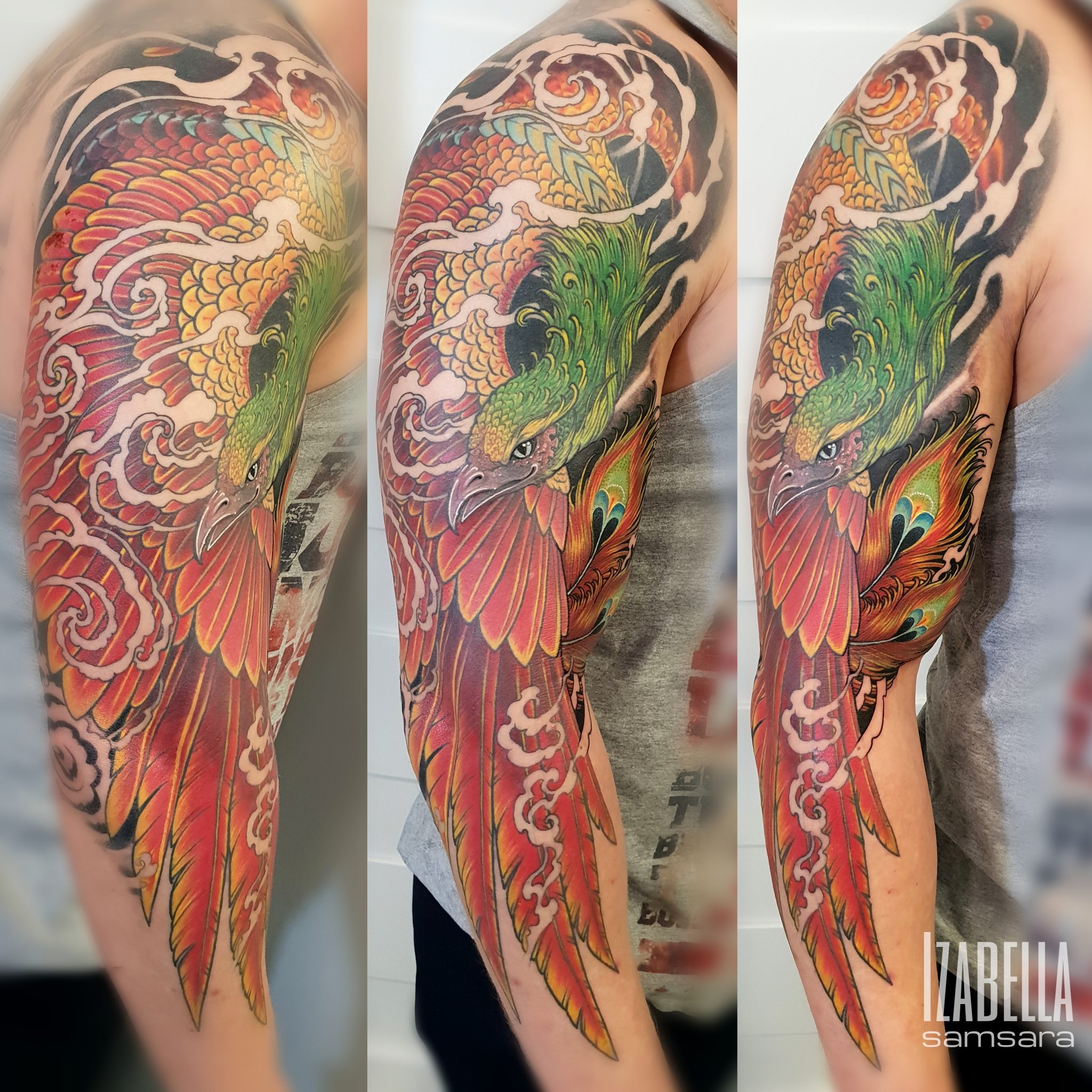 Vivid colorful tattoo of a phoenix with green and red feathers, surrounded by swirling clouds, covering the entire upper arm. The tattoo displays intricate details and vibrant colors, showcasing the bird in a dynamic pose, emphasizing its majestic wings and fierce expression.