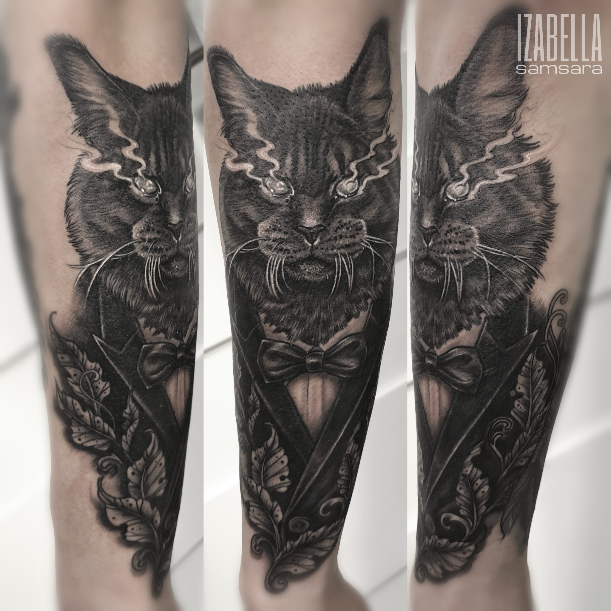 A detailed black and gray tattoo featuring a regal cat wearing a tuxedo with a bow tie. The cat's expression is fierce, with bright eyes and dynamic detailing that includes wispy lines around its head. Surrounding the cat are elegant floral elements, enhancing the overall sophisticated look. This striking tattoo showcases high levels of artistry and shading.