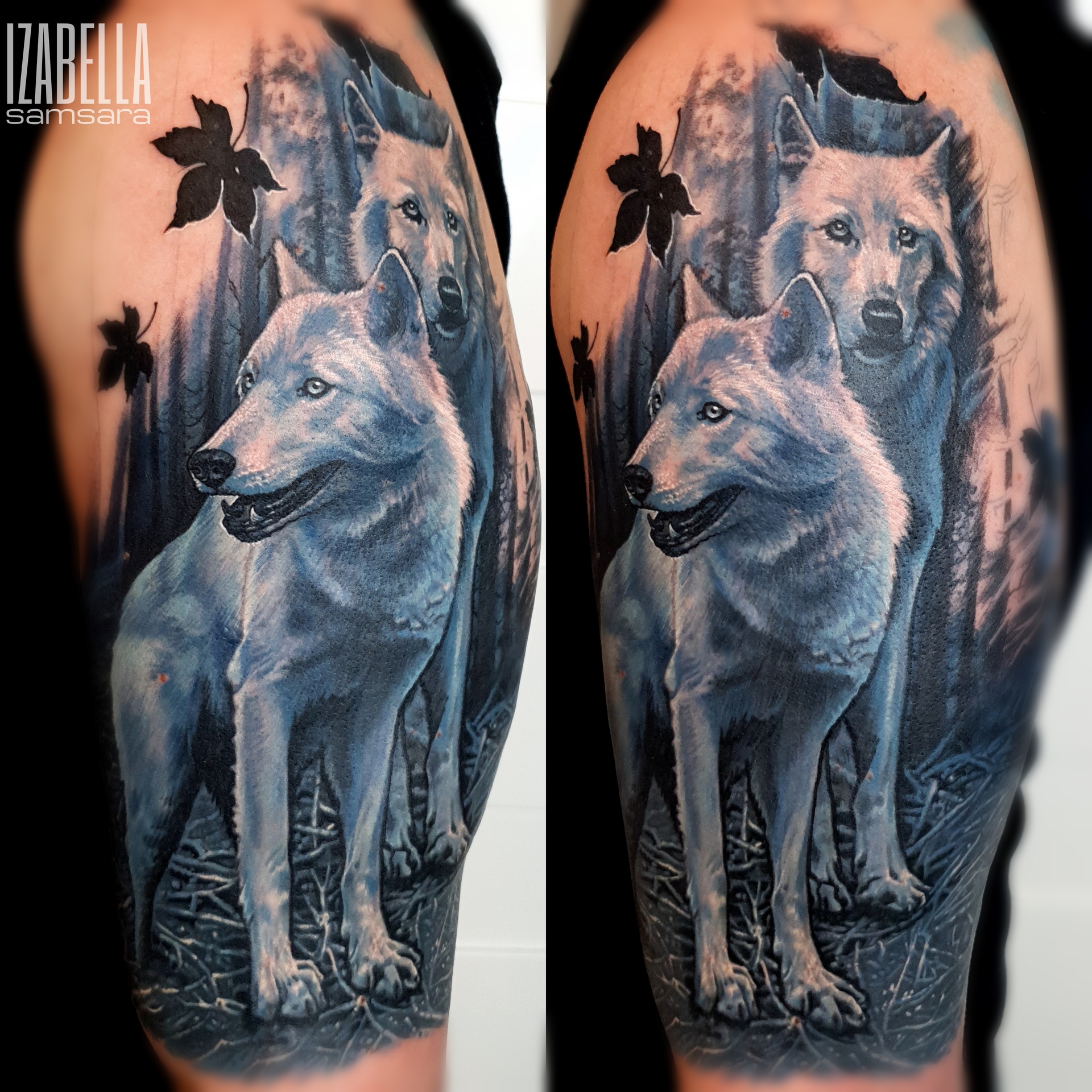 A stunning colorful tattoo featuring two realistic wolves in a forest setting. The foreground wolf is depicted with a vibrant white coat and a friendly expression, while the background wolf is slightly shadowed, creating depth. Surrounding the wolves are intricate details of foliage and trees, enhancing the natural scenery. This tattoo highlights the majesty of wolves and is perfect for animal lovers.