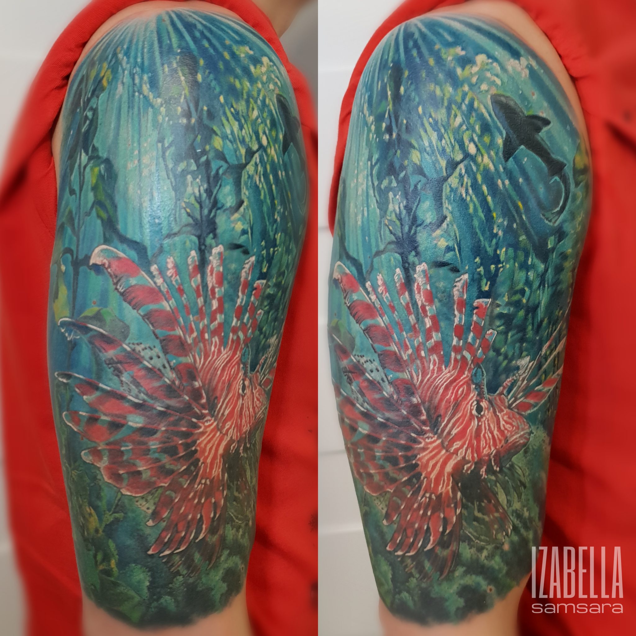 A vibrant tattoo featuring a colorful lionfish prominently displayed against a backdrop of underwater scenery, including green aquatic plants and a silhouetted shark in the distance. The tattoo showcases rich blues, greens, and reds, highlighting the lionfish's intricate patterns and the lively marine environment.