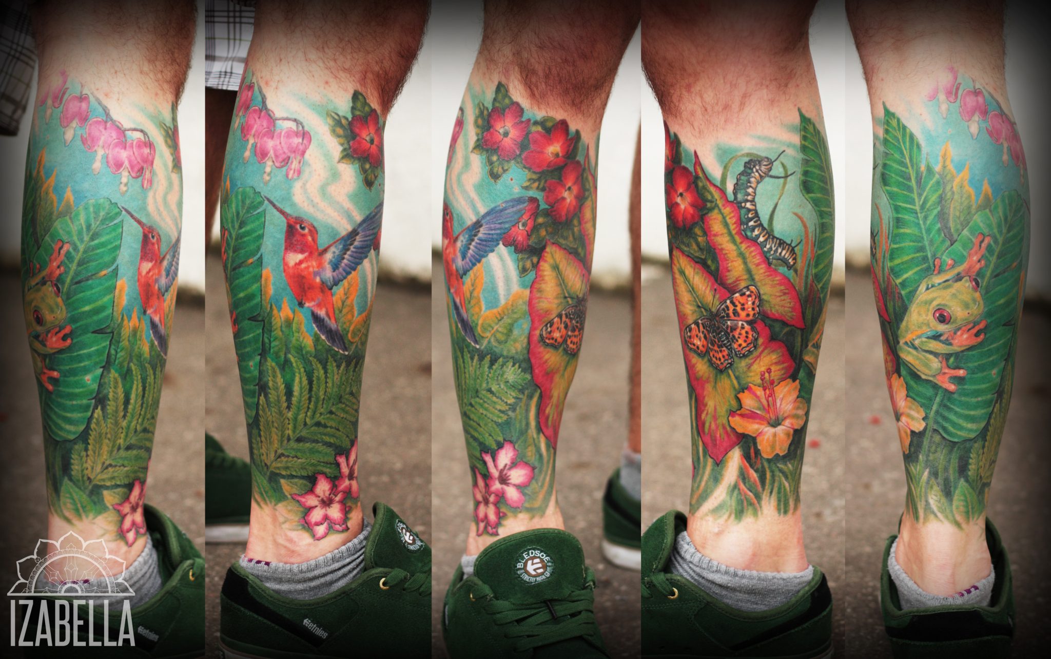 Vibrant leg tattoo featuring a hummingbird, a colorful frog, butterflies, tropical leaves, and pink flowers. The design showcases a rich blend of greens, reds, and yellows, encapsulating a lush jungle theme.