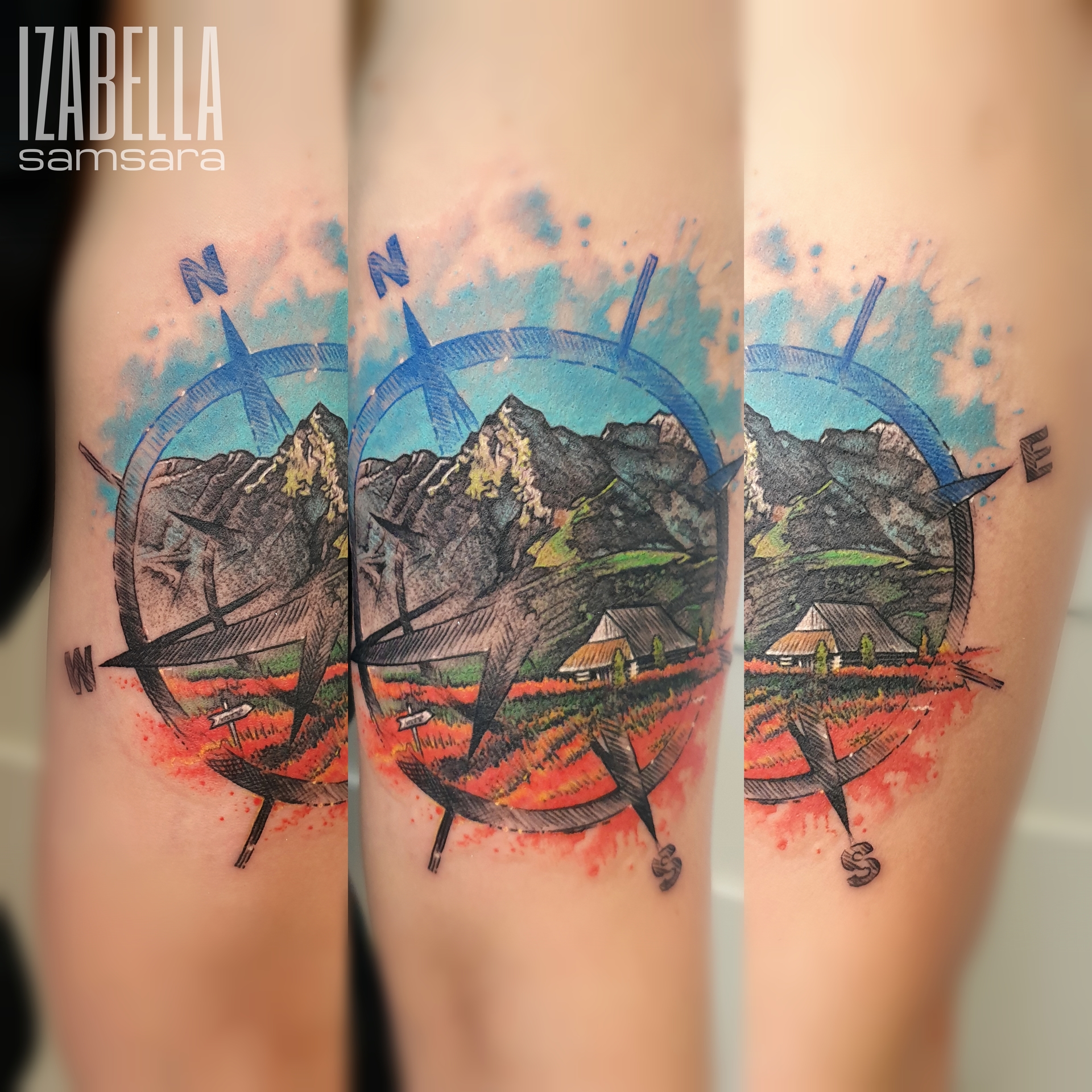 A colorful tattoo featuring a detailed compass design surrounded by a scenic landscape. The compass includes directional markers (N, S, E, W) and is set against a backdrop of majestic mountains, lush green fields, and a rustic farmhouse. The vibrant colors and shading create depth, with blue skies and hints of red detailing accentuating the landscape.