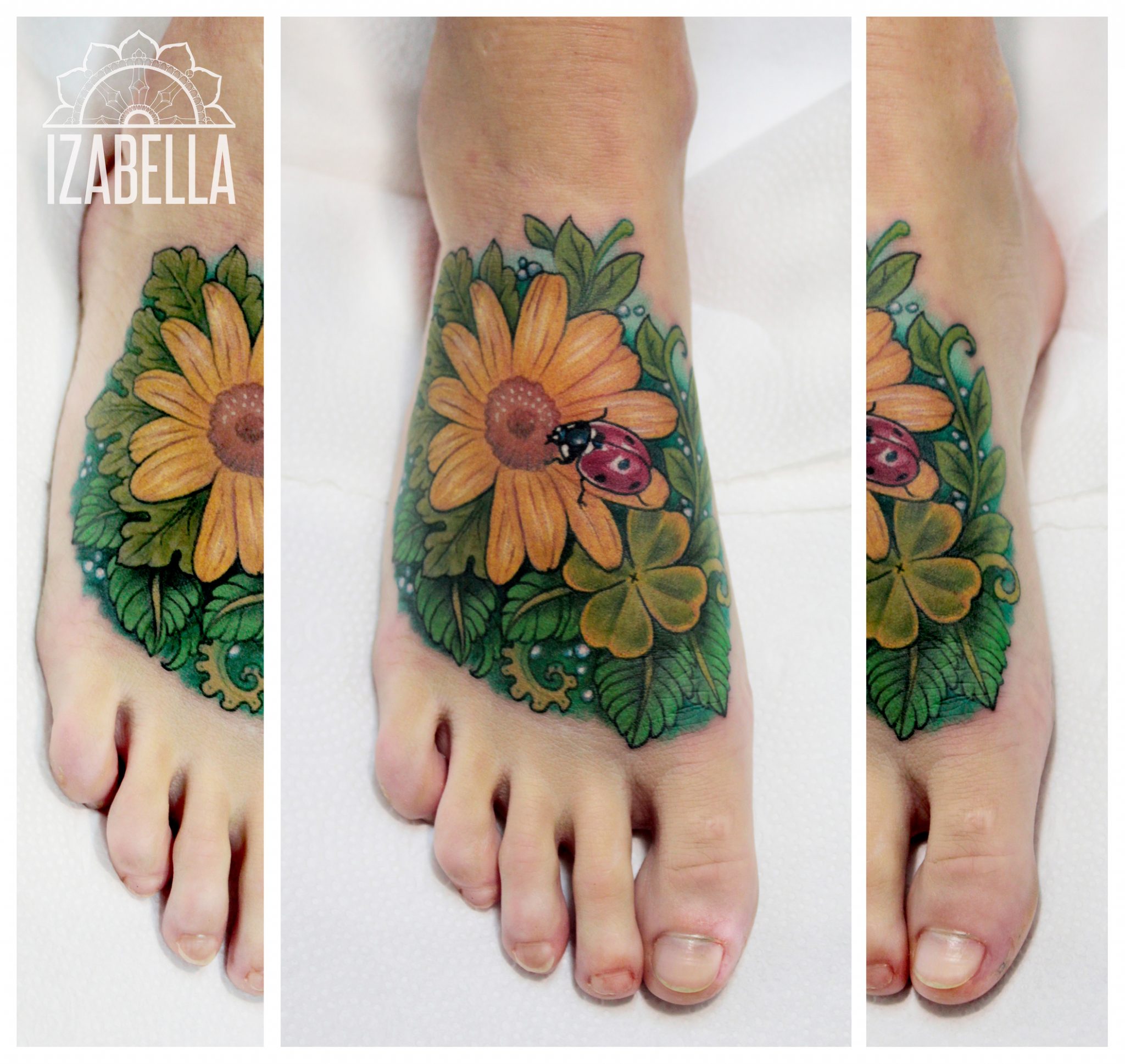 A vibrant tattoo on the foot featuring a large yellow sunflower surrounded by green leaves and a ladybug. The design includes a four-leaf clover, adding a touch of luck to the composition. The colors are bright and lively, making the tattoo stand out beautifully against the skin.