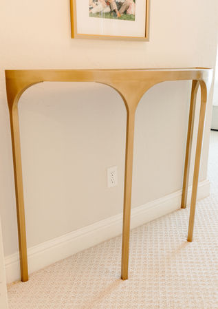 Custom brushed gold demilune console table with mirror top, custom metal fabrication by Matulis Works Oklahoma City