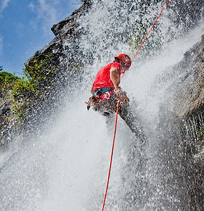 Repelling waterfall in Bocawina Belize