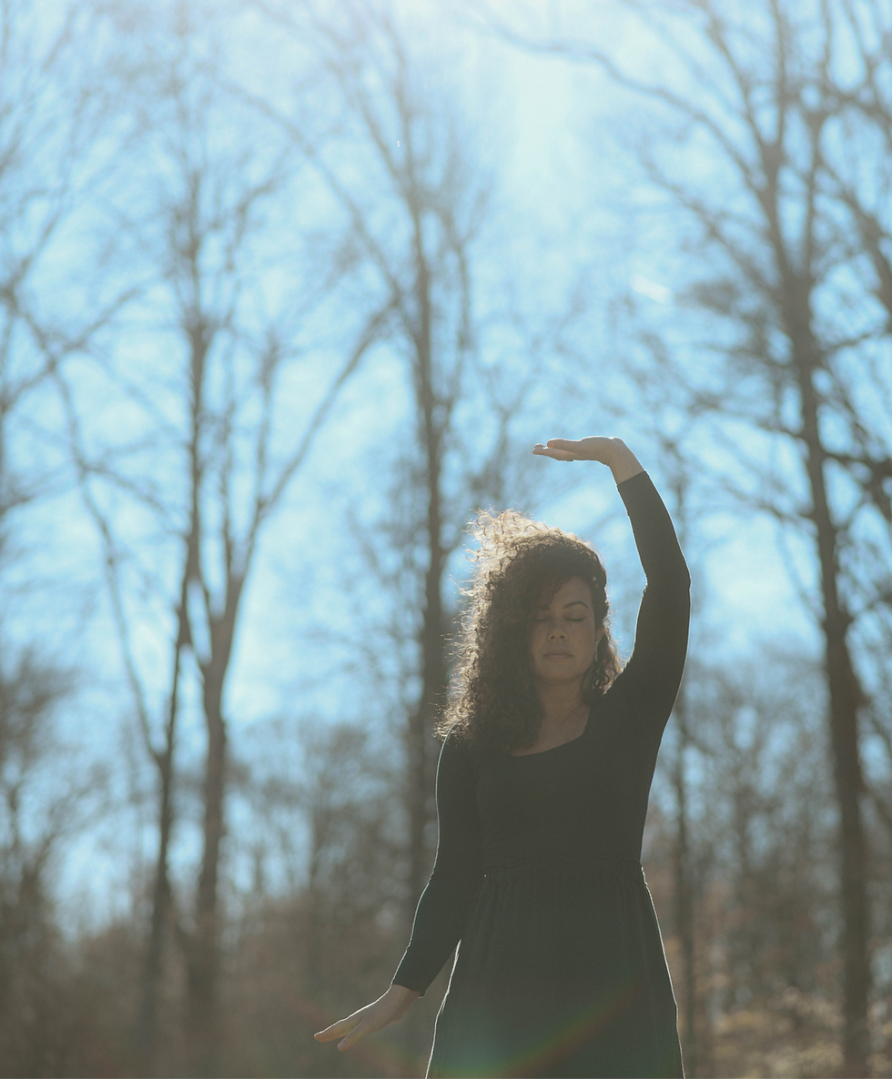 Mara enjoying a quiet moment in nature, reflecting her grounded approach to holistic wellness, Qigong and self help