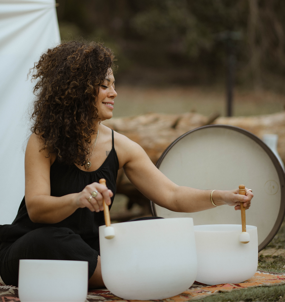 Mara guiding a gentle Qigong practice in nature, blending breathwork and movement at Serenità Retreats, a women's wellness retreat in Italy