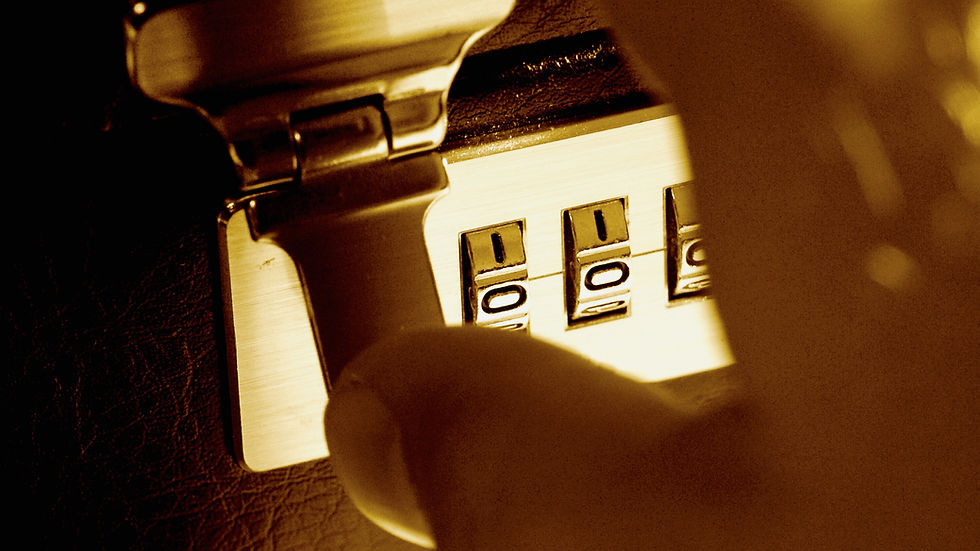 Man opening up a combination lock.