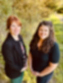 Two women standing next to eachother in an outdoor setting, these women are Lyris Salvi and Dane Fisher, Founders of Integrated Psychology Group