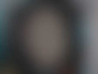 Dart board mounted in cabinet with steel tip darts and scoreboard for home darts setup