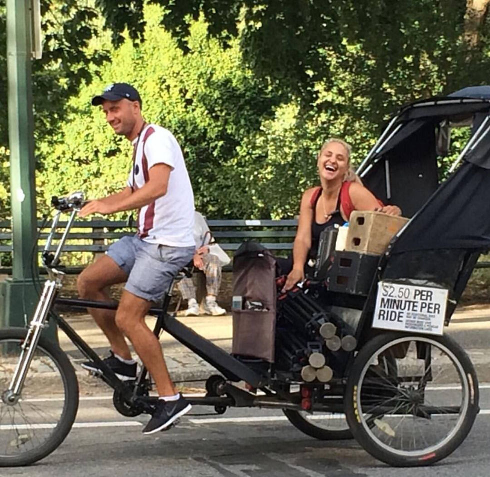 Eye-level view of a pedicab parked near a Central Park pathway