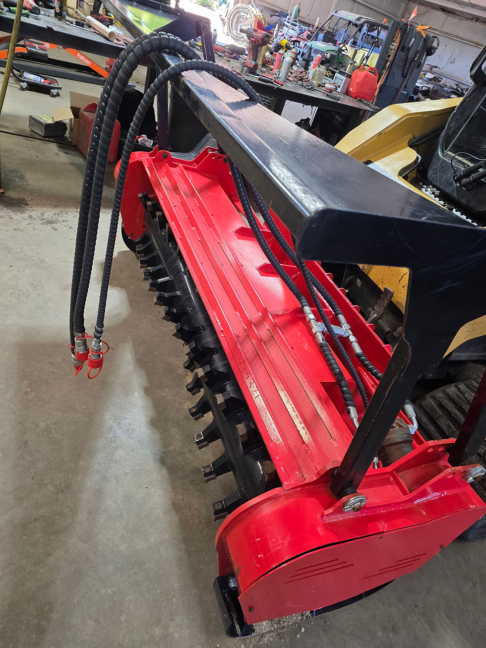 Side view of GIYI Skid Steer Mulcher (red)