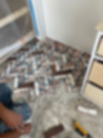 Installing thin bricks on the house floor