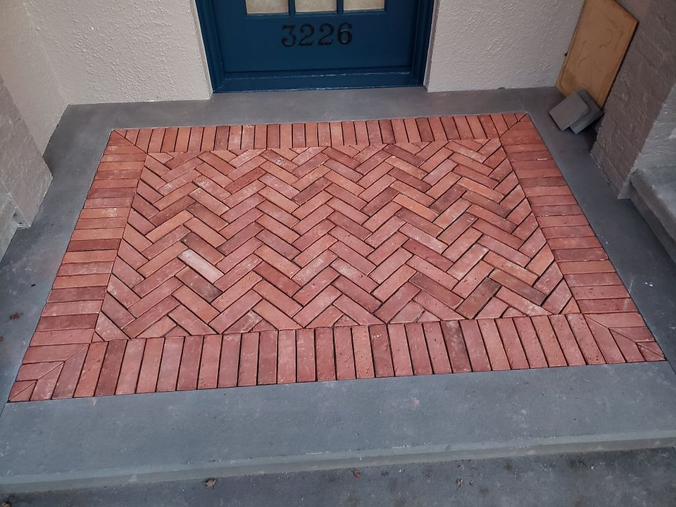 Completed installation of herringbone patterned red bricks