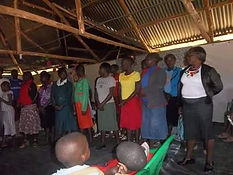 My wife Beatrice singing among the group og our church choir.jpeg