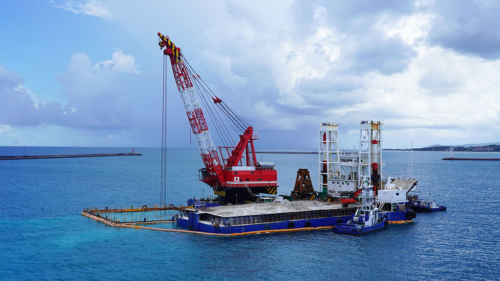 a floating crane platform extracts white sand from the bottom of the Pacific Ocean