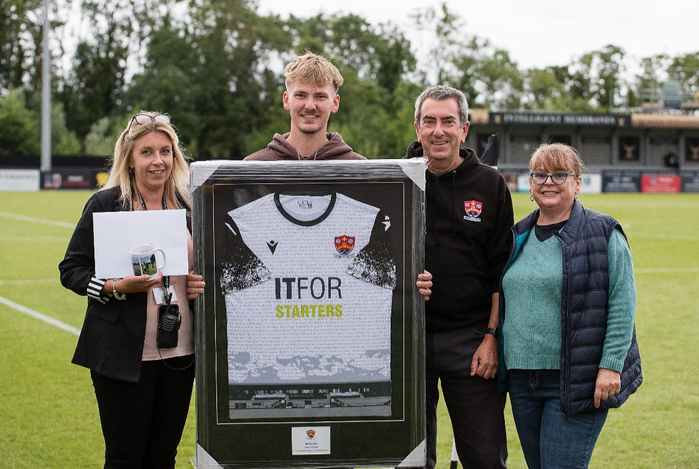 Ben Saich, along with proud Dad, Philip, and Mum, Karen, being presented with a framed shirt by General Manager Alice Dewey