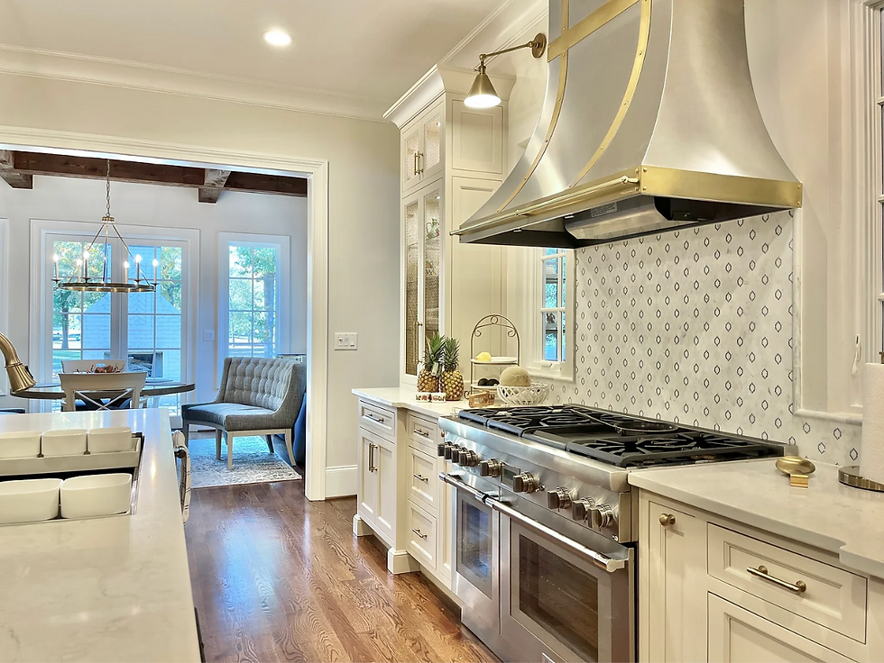 french country kitchen with statement range hood in chapel hill