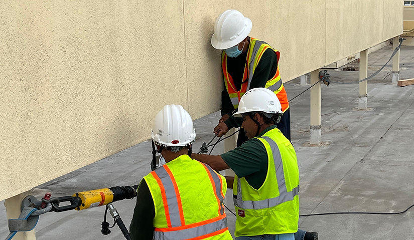 csg-specialty-service-workers-work-on-window-washing-systems-roof
