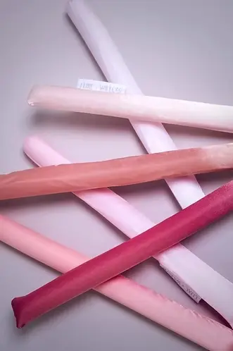 Thumbnail: Set of satin heatless curling rods neatly displayed for overnight curling.