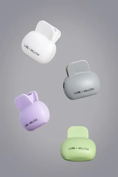 Toothbrush covers in a 4-pack featuring white, gray, purple, and green hygienic travel caps.