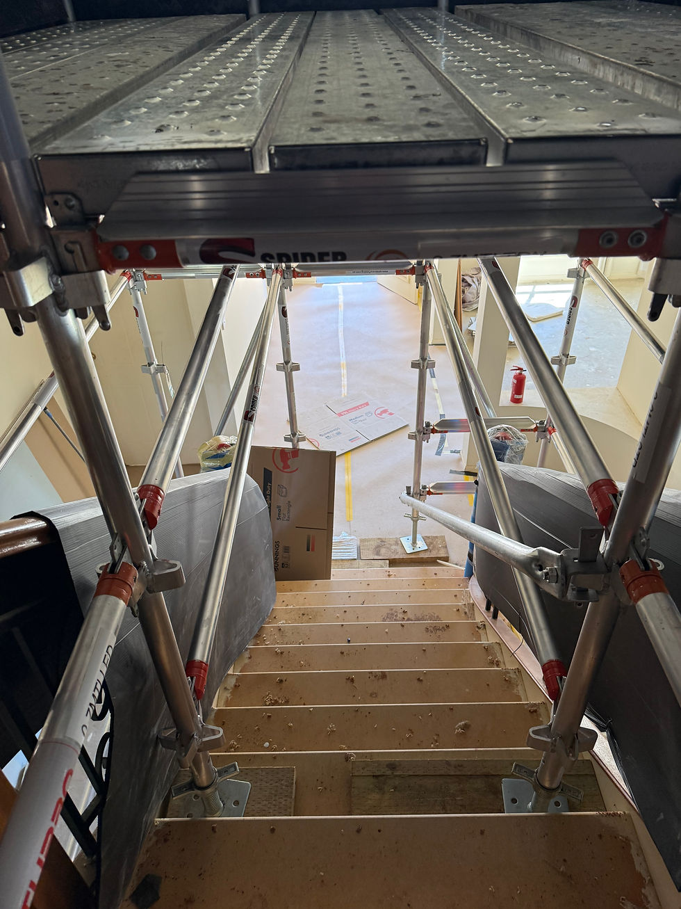 Custom aluminium and steel scaffold built over stairs for ceiling access